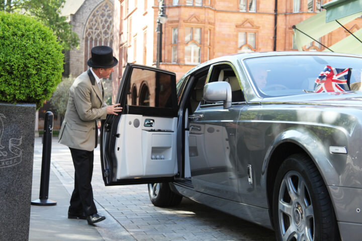Doorman opening Rolls Royce Phantom