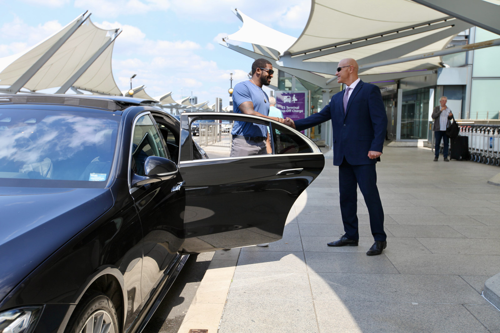 Chauffeur and client meet and greet at Heathrow Airport